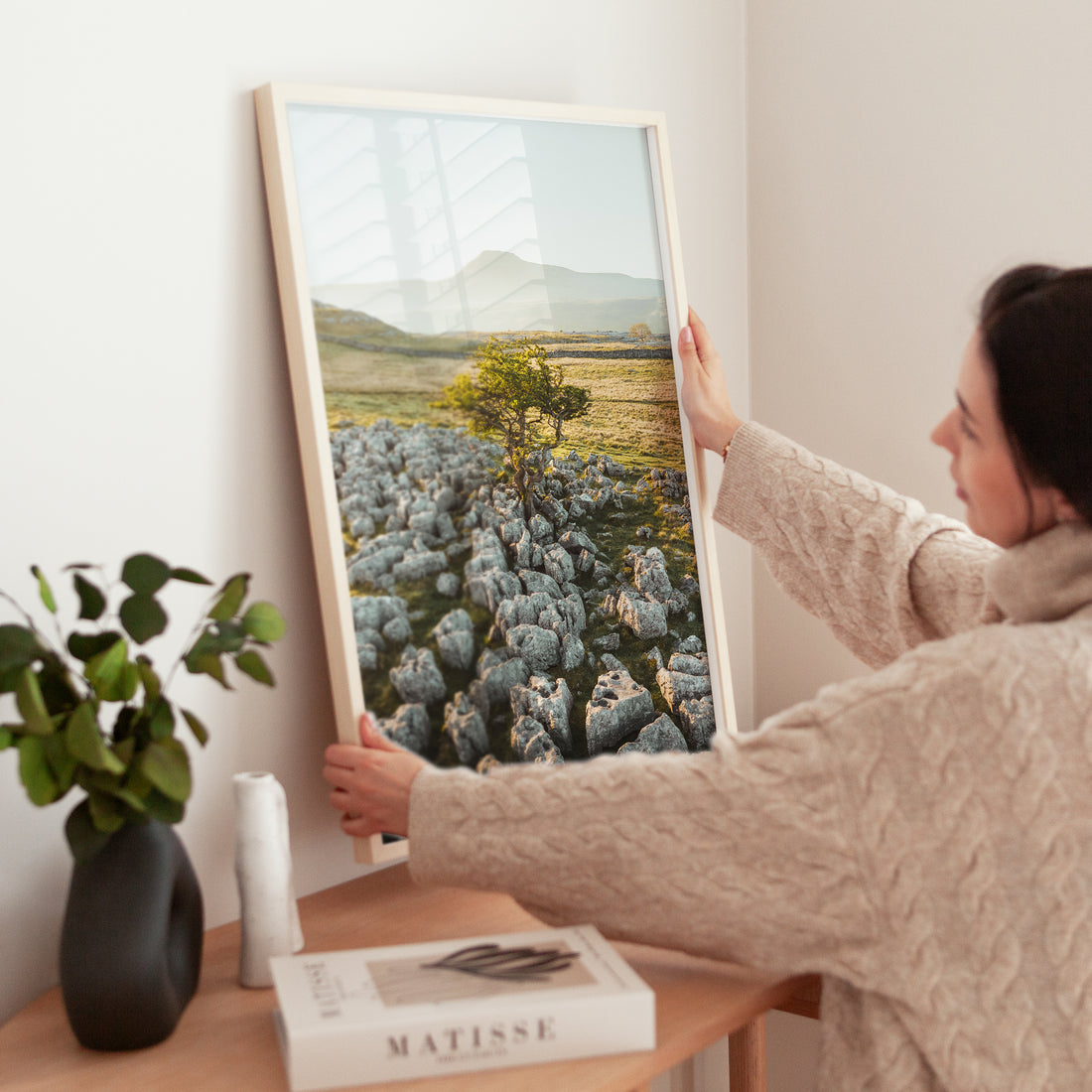 Minimal home interior with framed Ingleborough tree landscape print