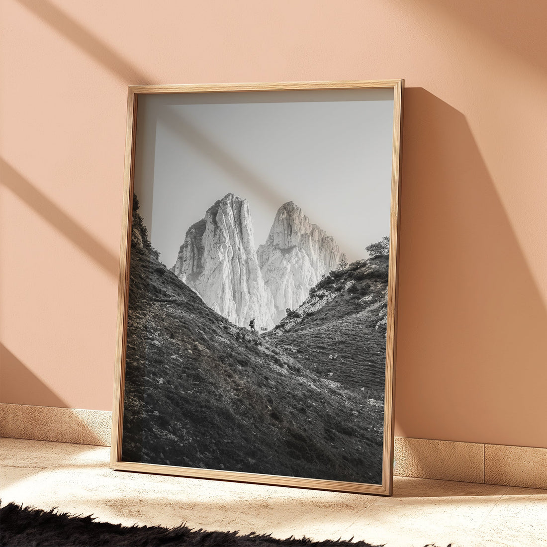 Saxer Lücke black and white fine art print with Alpine hiker leaning on soft pink wall