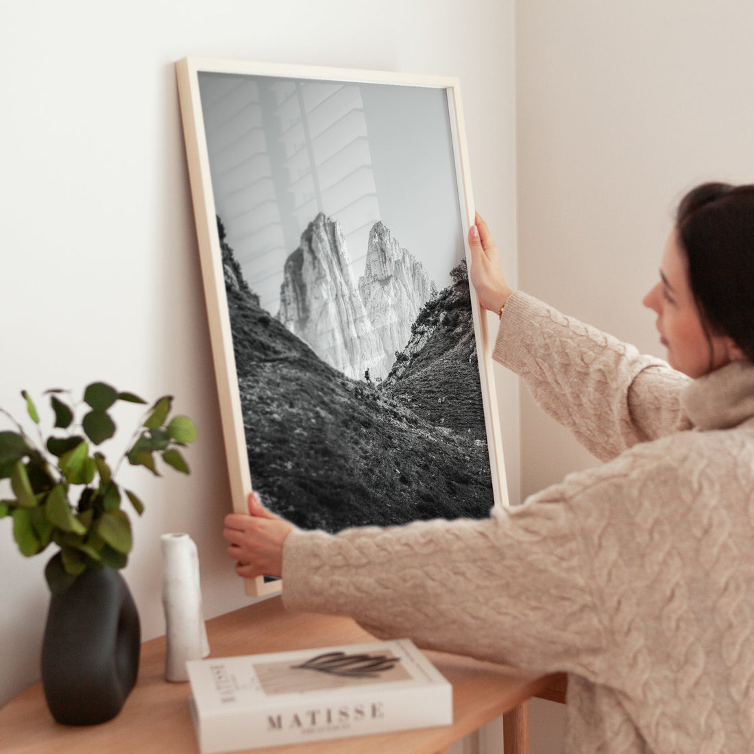 Minimalist interior with hiker wall art print of Saxer Lücke Swiss mountains
