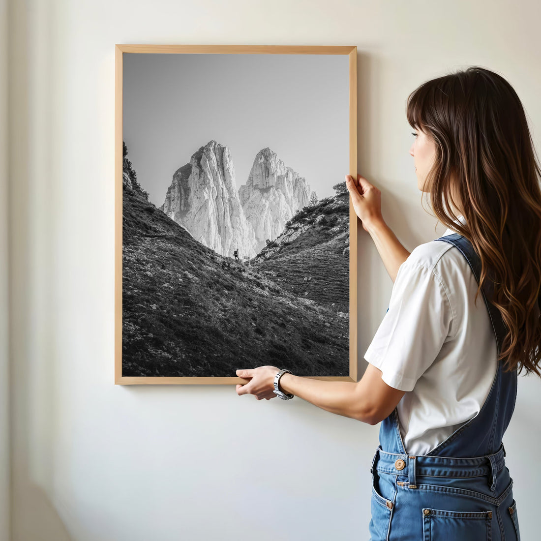 Modern framed Saxer Lücke Alps photography print being hung on a white wall