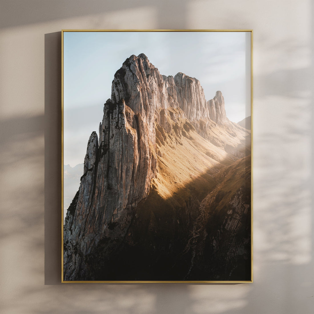 Saxer Lücke mountain wall art in golden hour light, framed and hanging on a warm-toned wall.