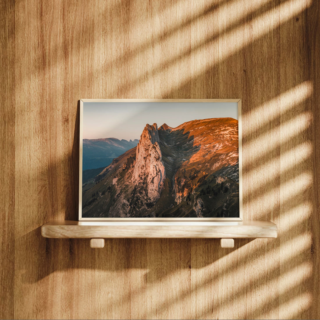 Photography print of the Saxer Lücke mountain ridge glowing at sunrise above the Swiss Alps valley.