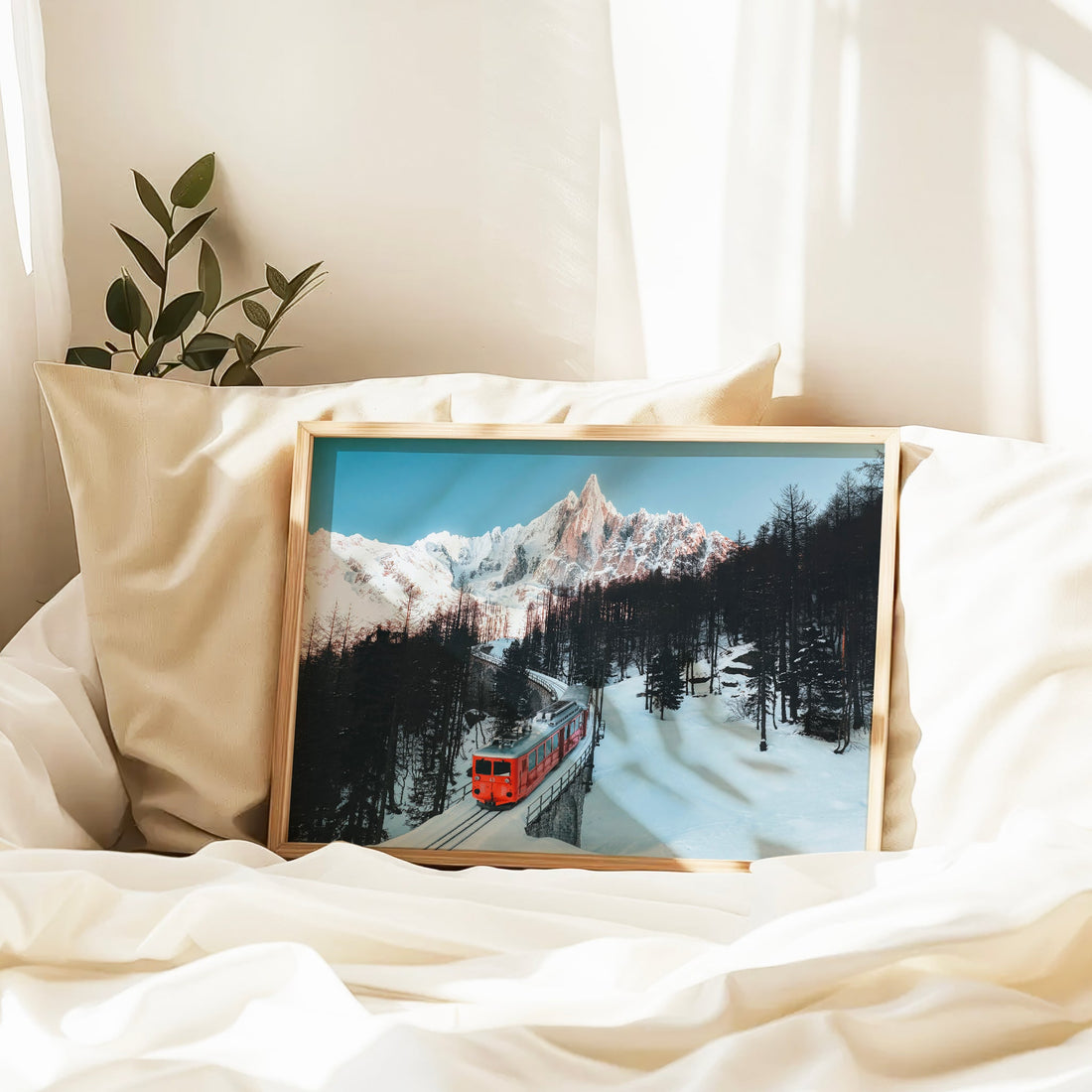 Scenic Swiss Alps train photography capturing a vintage red locomotive navigating a snowy mountain pass.