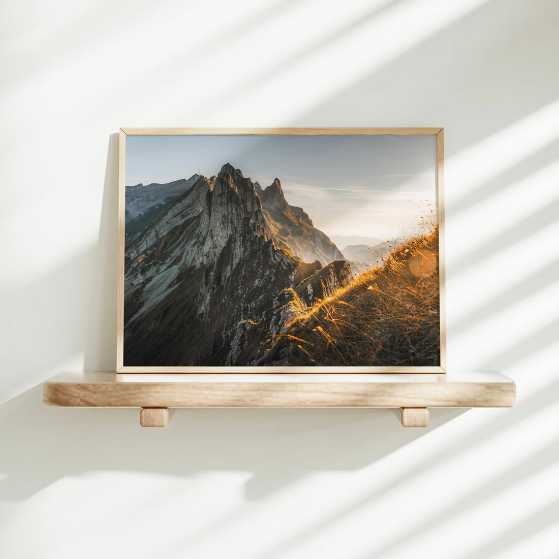 Framed landscape print of Schäfler Ridge with sharp rock formations glowing in early morning sun.