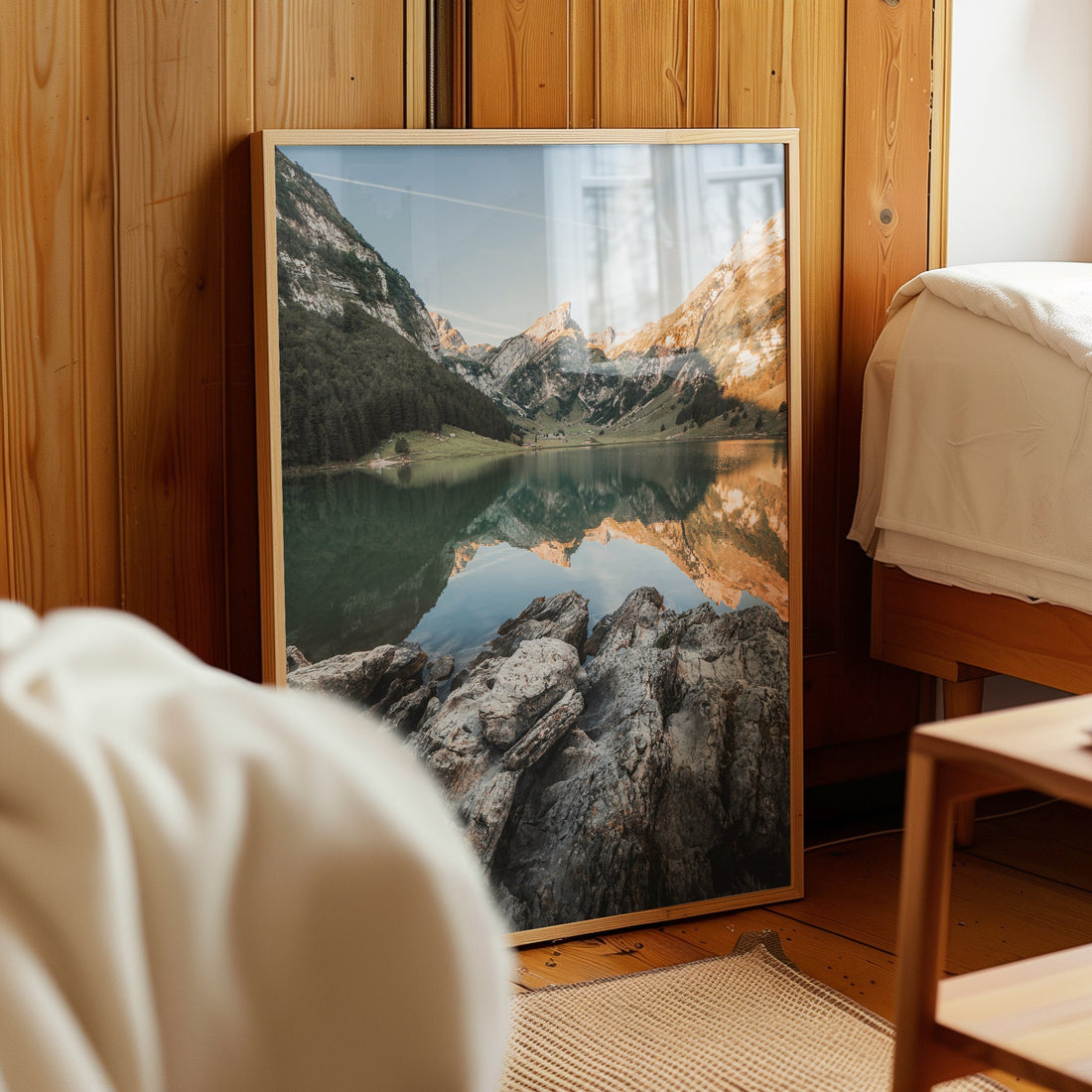 Peaceful alpine lake photography print of Seealpsee with dramatic peaks and forest reflections.