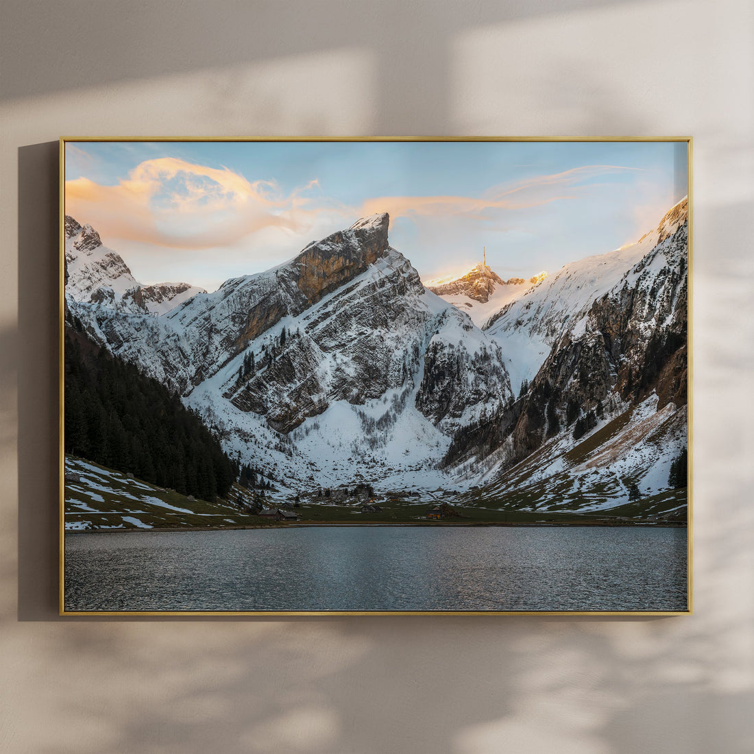 Snow-covered Seealpsee mountain landscape print featuring golden light on the summit at sunset.