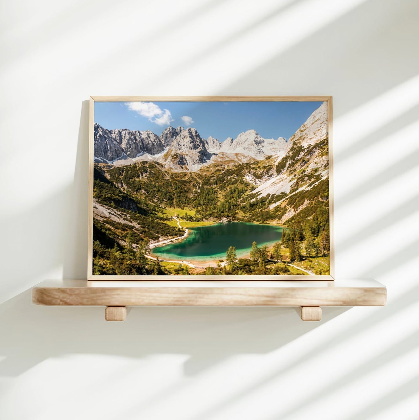 Seebensee lake wall art displayed on minimalist shelf in natural light