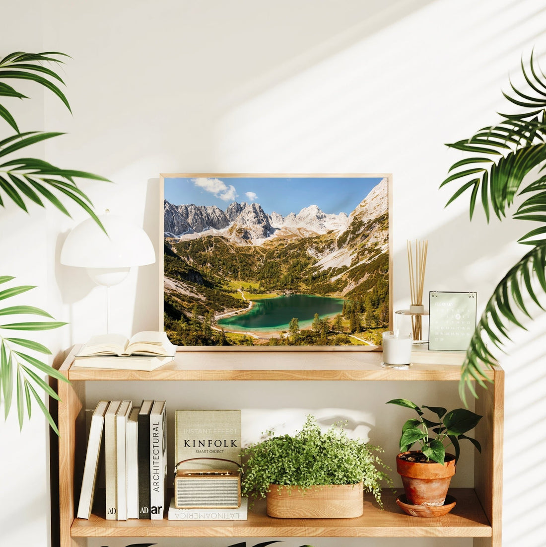 Seebensee Austria print styled on a shelf with books, plants and soft lighting