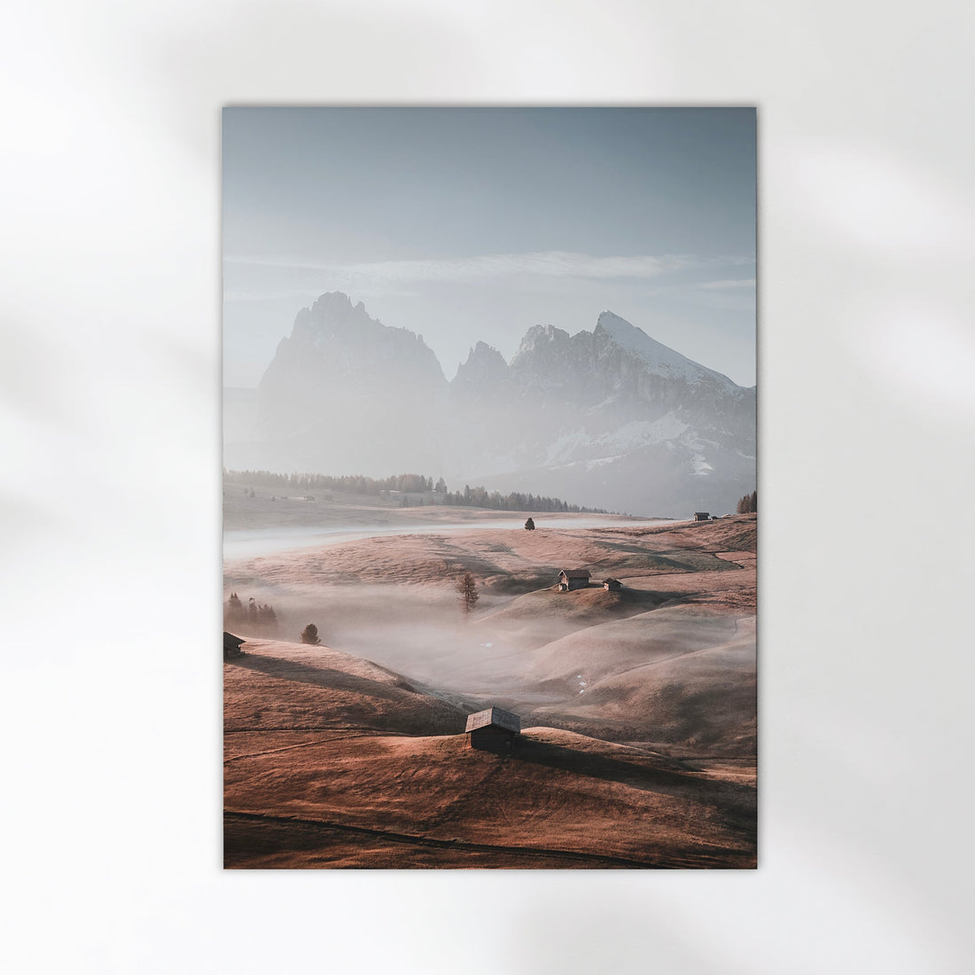 Serene landscape photo print of Seiser Alm with golden fields and mist rising beneath the snow-covered peaks.