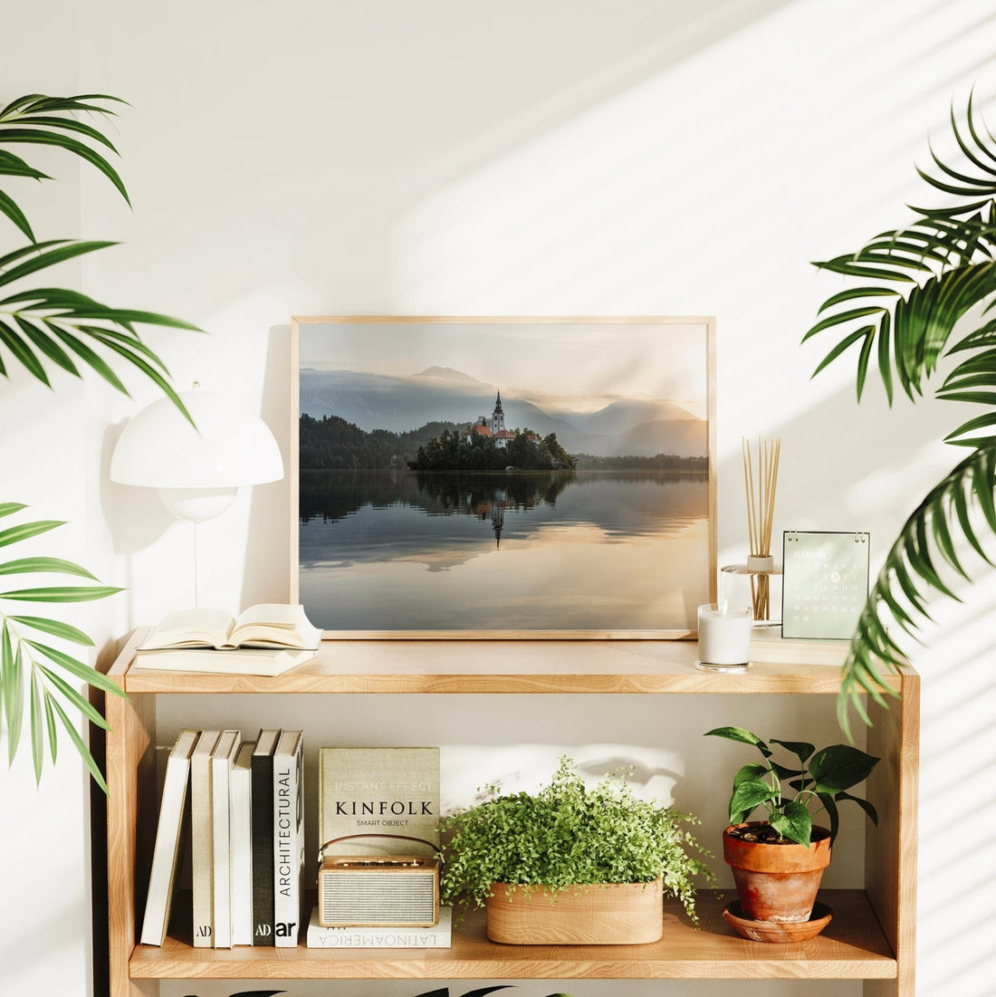 Serene lake sunrise with church on island and calm water
