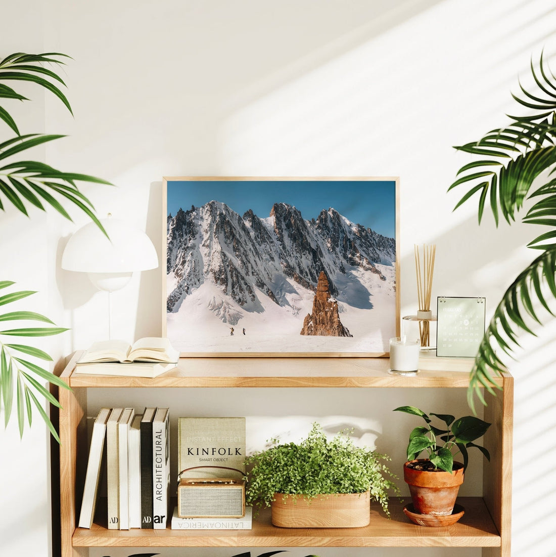 Chamonix photography print capturing ski tourers trekking across the glacier under the shadow of Les Droites.