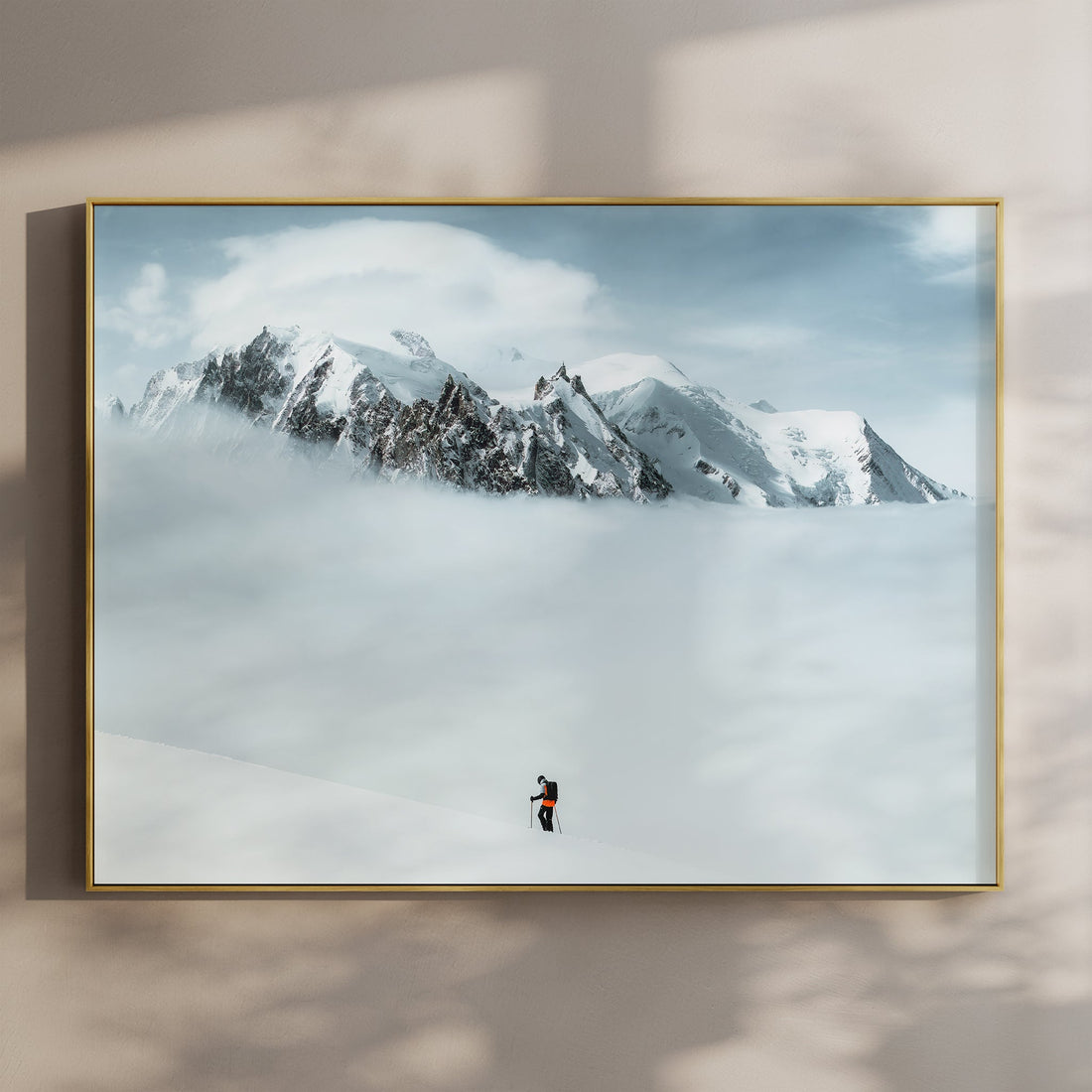 Breathtaking Mont Blanc Massif print featuring a lone ski tourer navigating through pristine alpine snow.