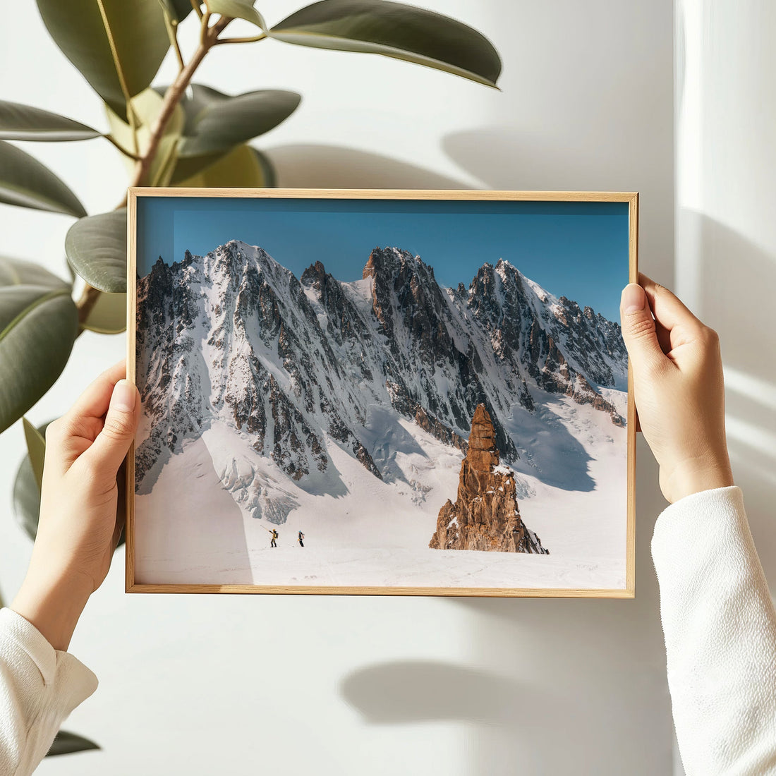 Minimalist winter art print of snowy peaks and backcountry skiers beneath the Mont Blanc Massif.