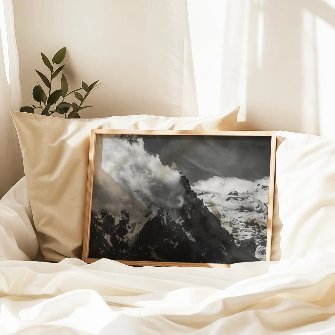 Chamonix snow-capped mountain wall print in black and white with Aiguille du Midi cloaked in cloud.