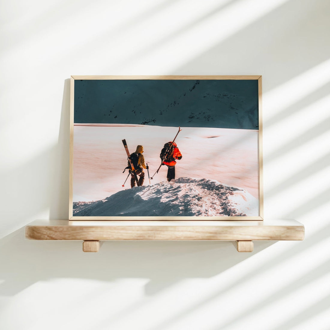 Fine art photography print of ski tourers preparing to descend a pristine snowy ridge in the French Alps.