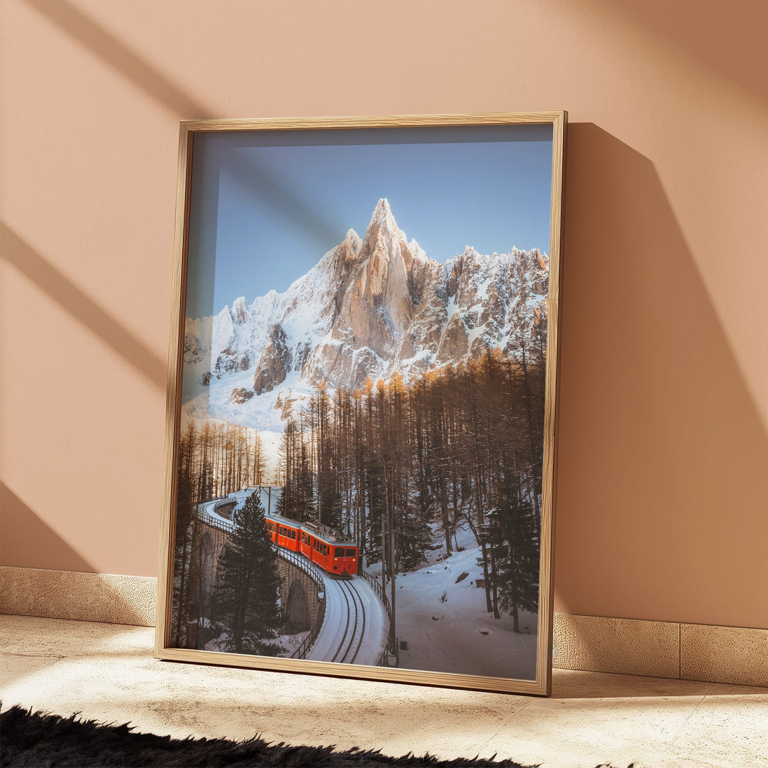 Beautiful wall art print of the Montenvers Train navigating snowy mountain terrain beneath towering peaks.