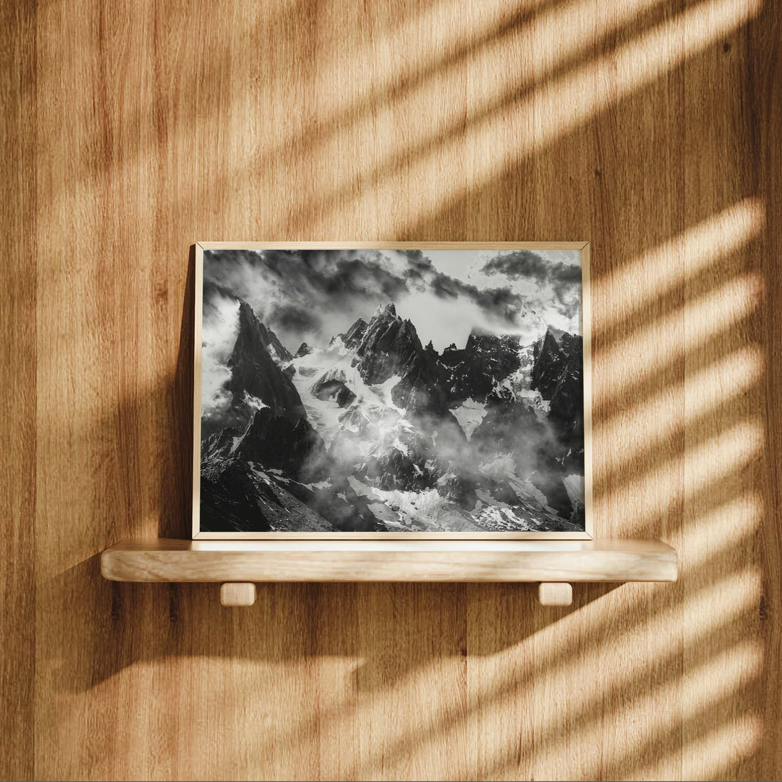 Fine art mountain photography print of storm clouds sweeping over the dramatic Chamonix Aiguilles.