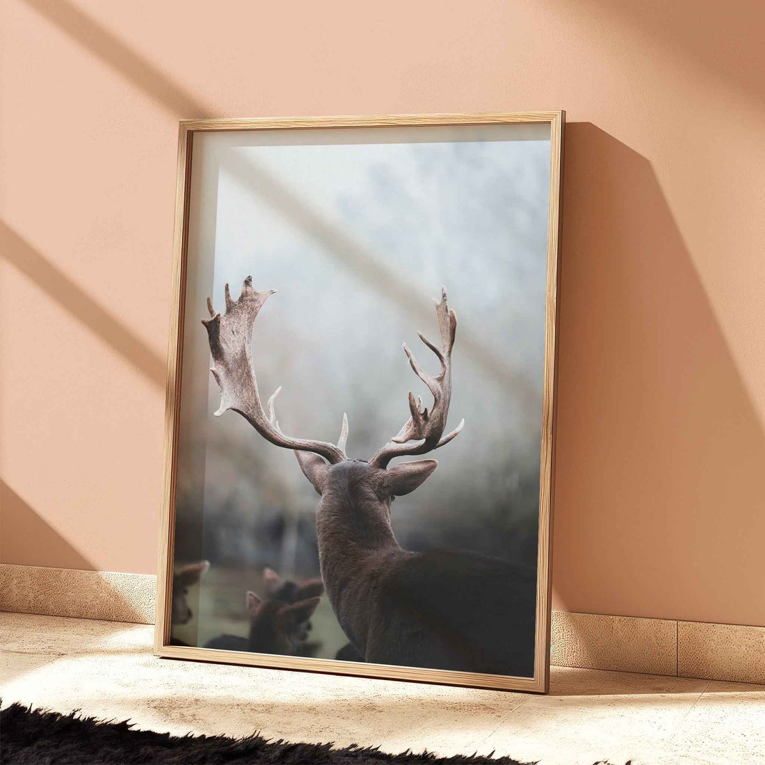 Fine art photography of a stag in Bavaria with fog and soft tones