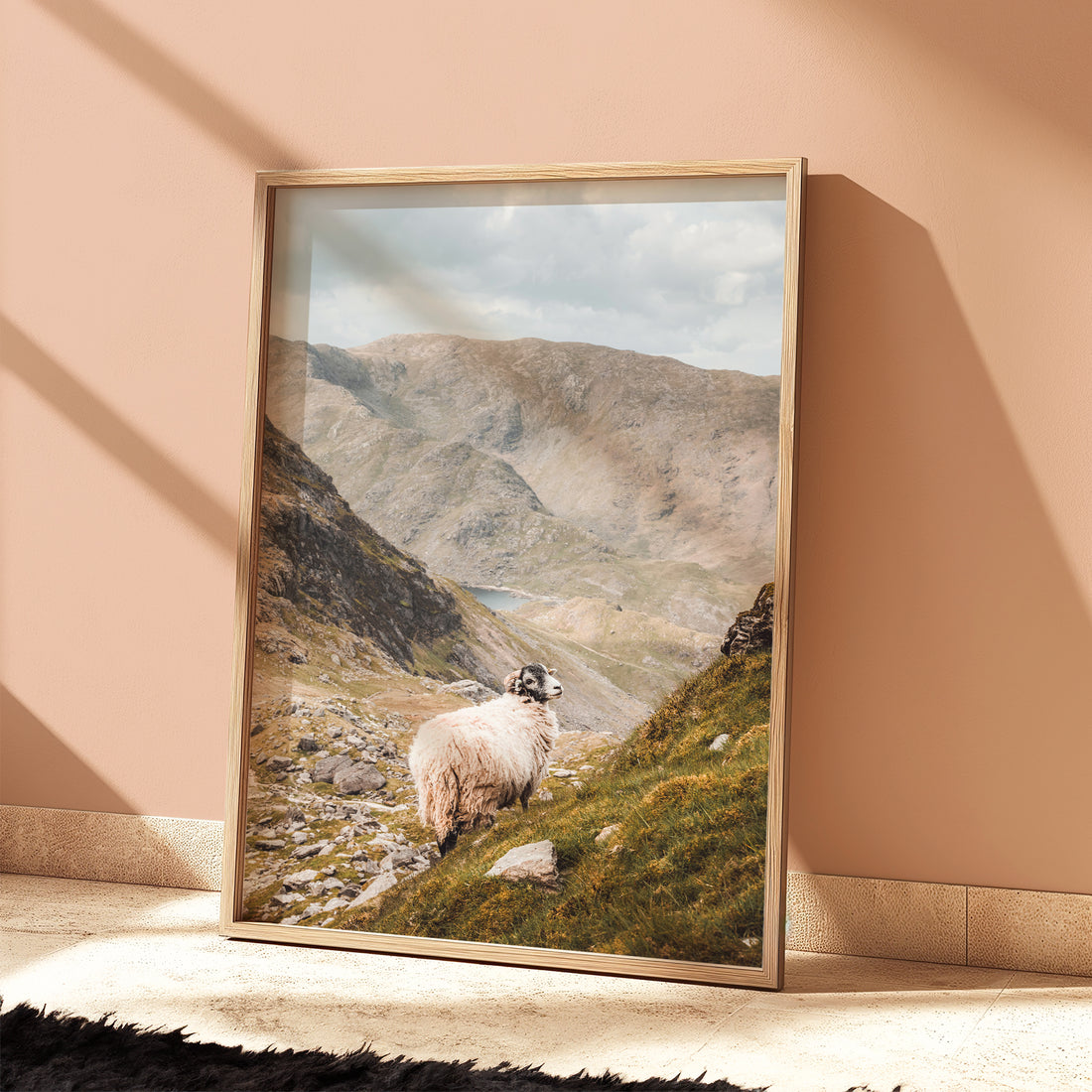 Light-filled mountain wall art of a Herdwick sheep and valley below the Old Man of Coniston.