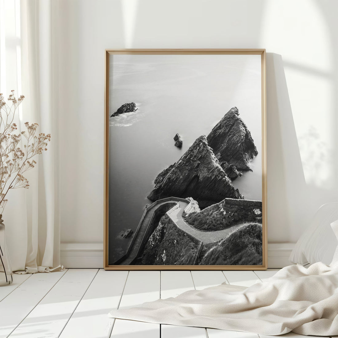 Dunquin Pier print in a bright white room with coastal decor