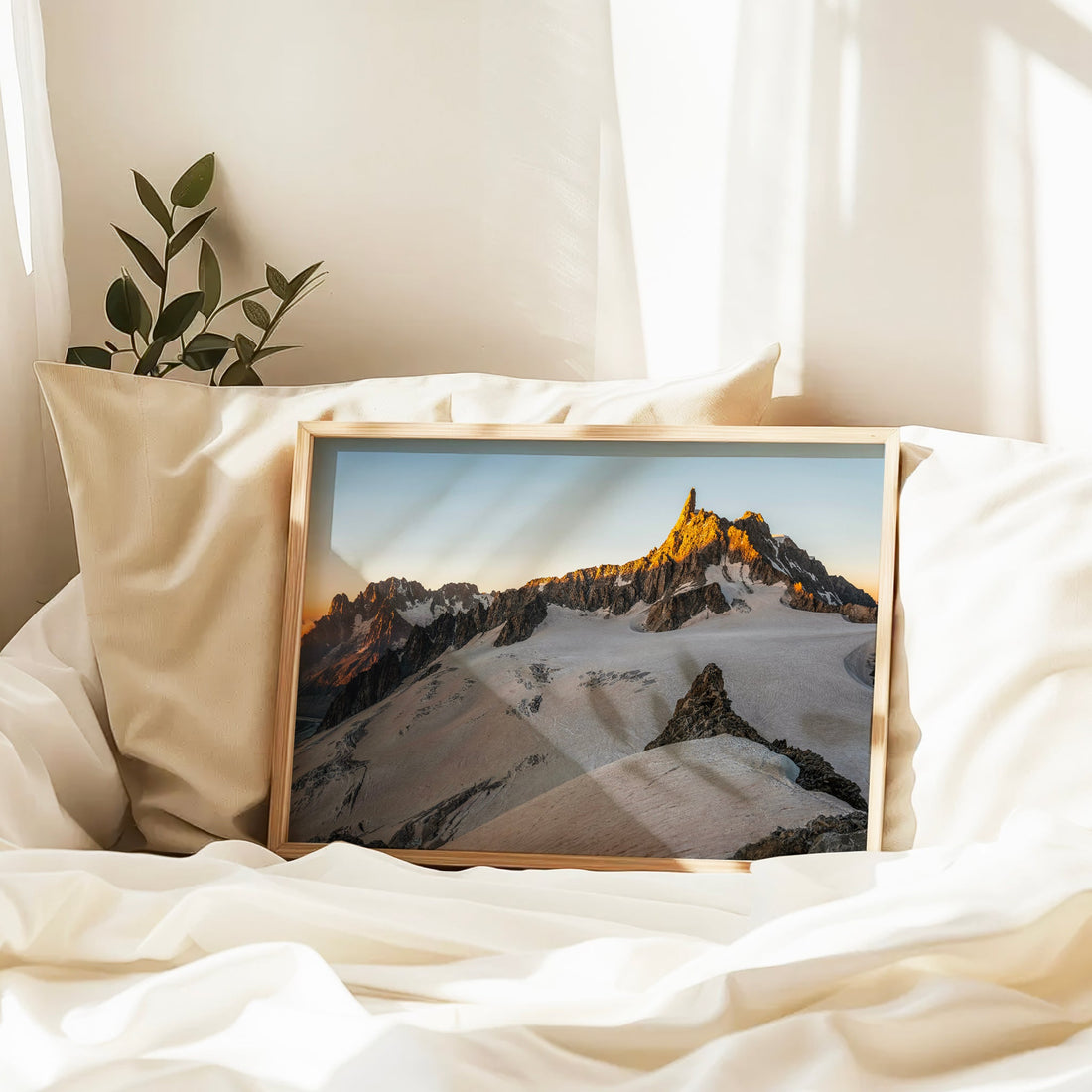 Modern mountain wall art featuring Dent du Géant lit by sunrise above soft glacier snowfields.