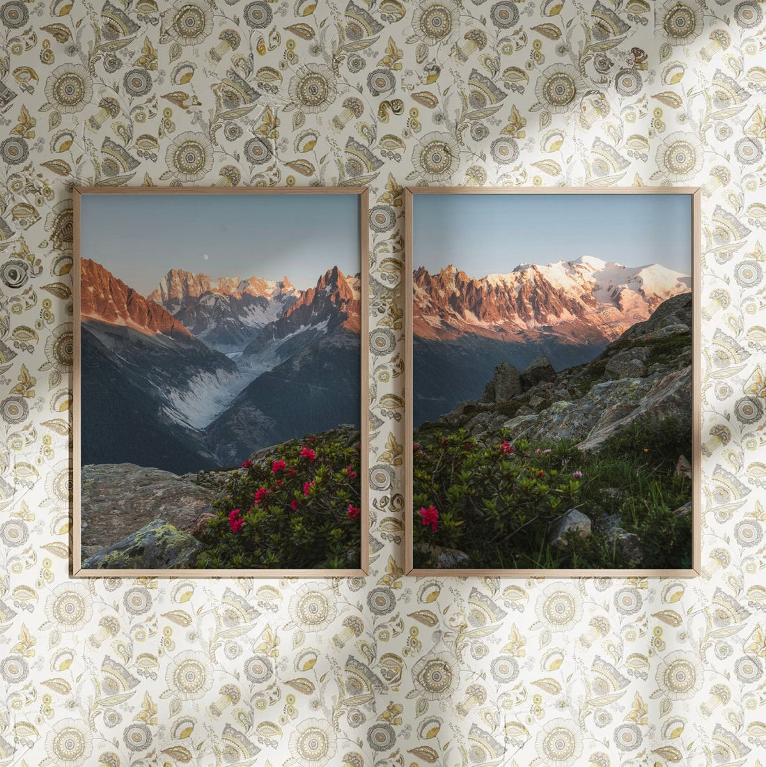 Decorative framed prints showcasing a sunset mountain landscape with vivid wildflowers, against a patterned wall background.