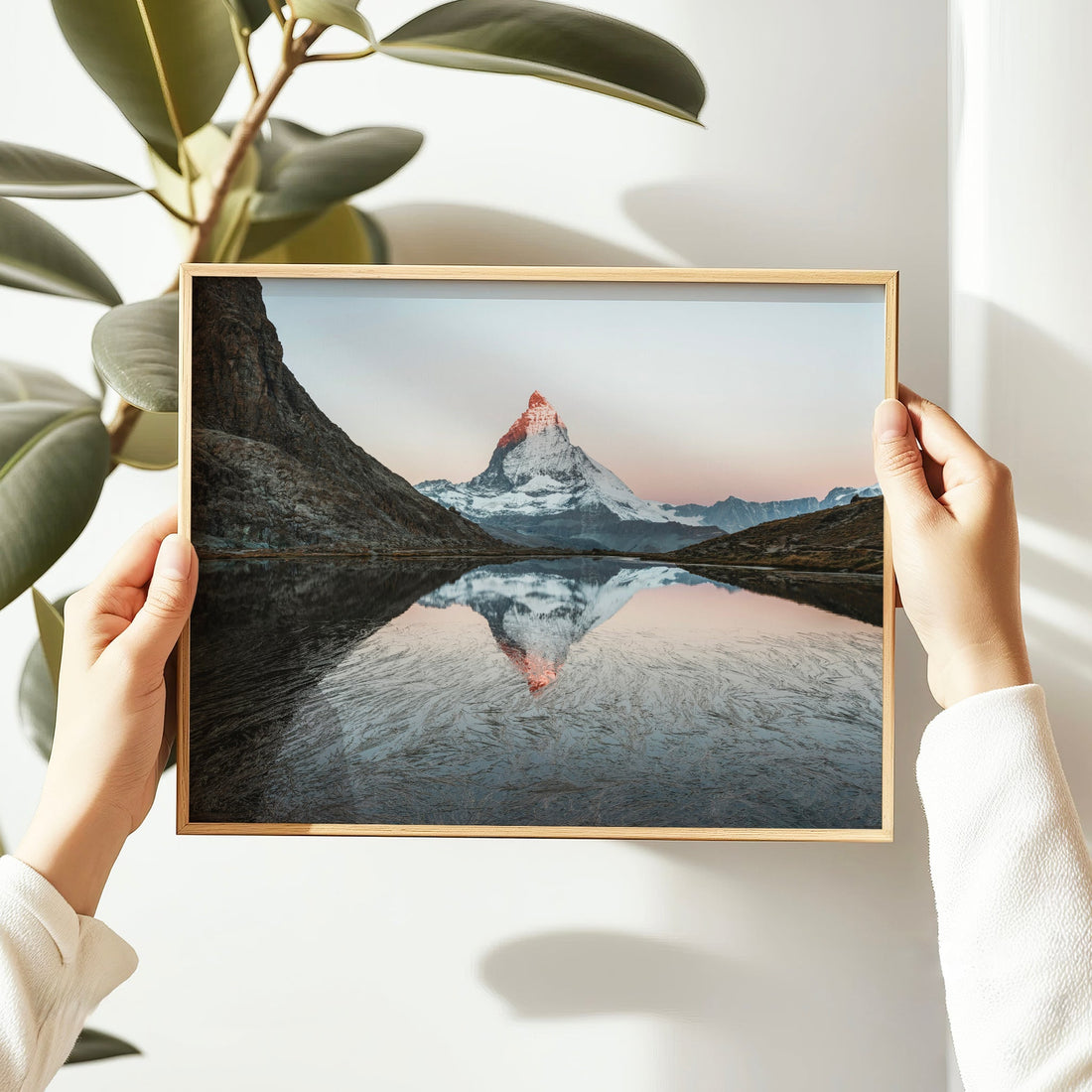 Serene framed photo of the Matterhorn and tranquil Riffelsee lake in the heart of the Swiss Alps.