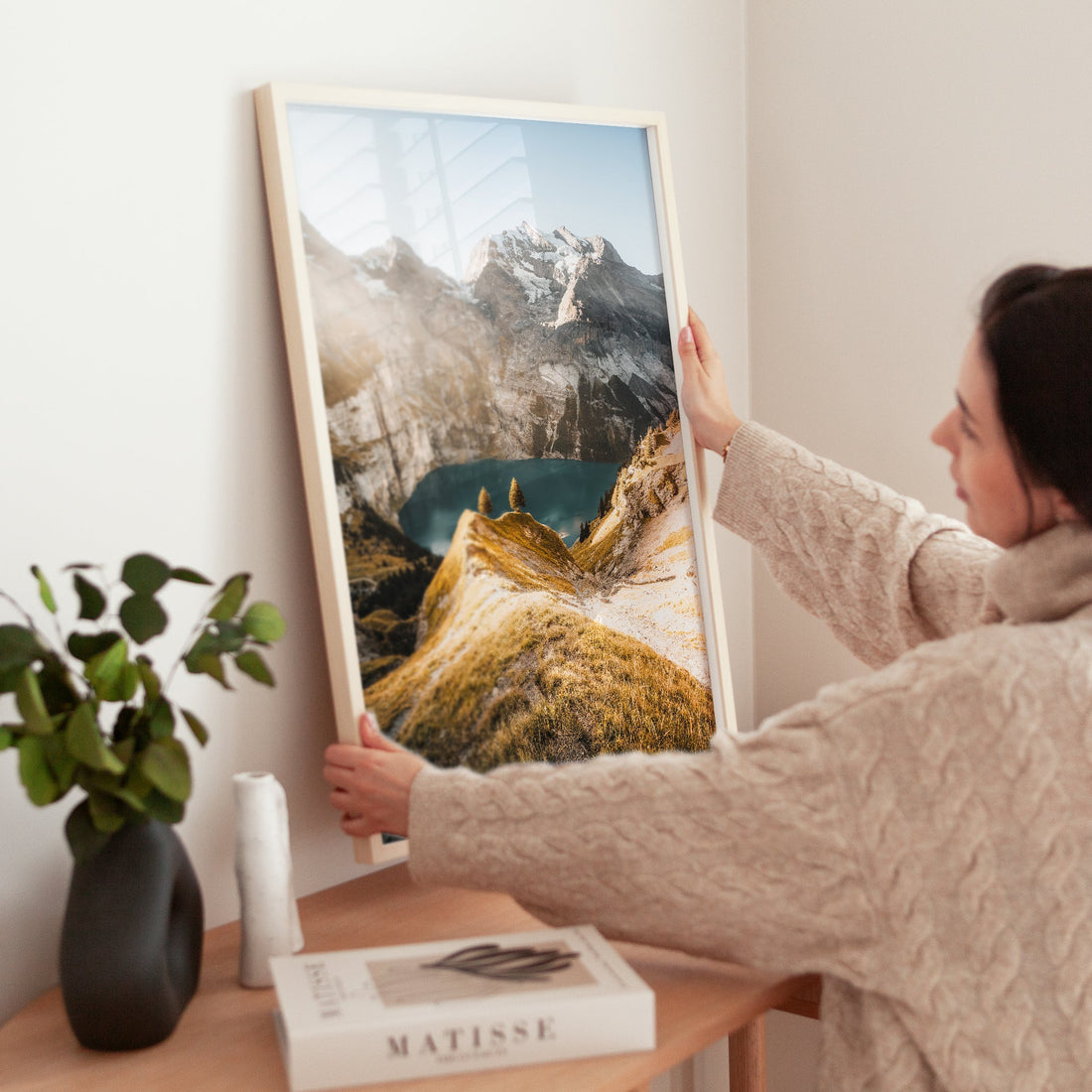 Sunset over Oeschinensee, a magical Swiss Alps lake art print capturing warm light on rugged mountain landscapes.