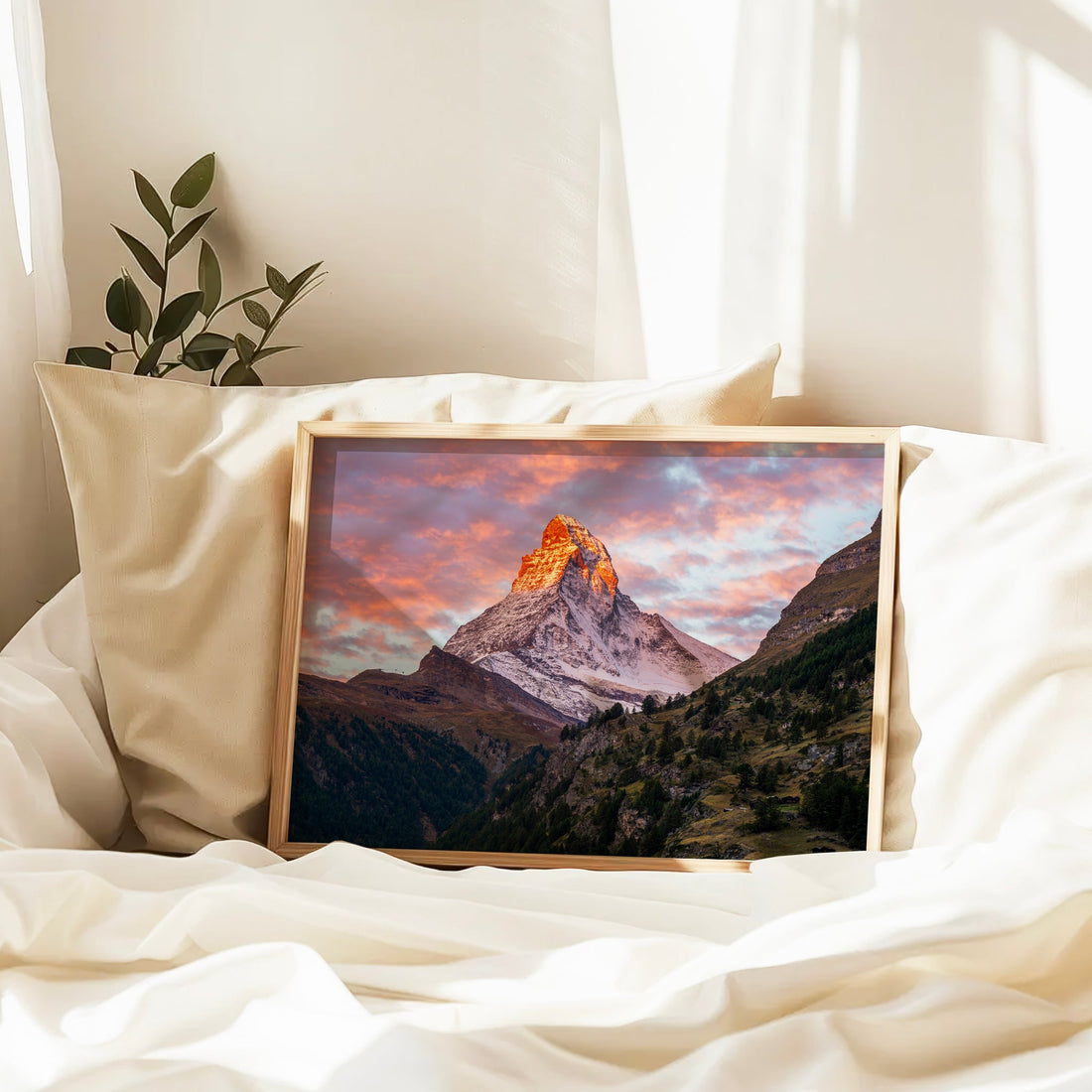 Swiss mountain photography artwork of the Matterhorn glowing orange against a pastel sky.