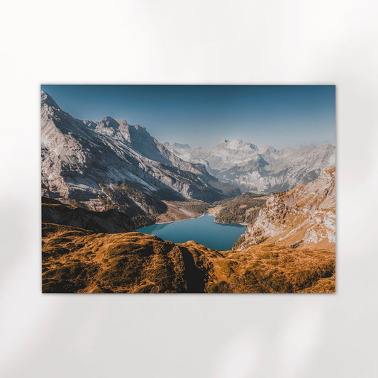 Oeschinensee lake in Switzerland with autumn tones and rugged peaks