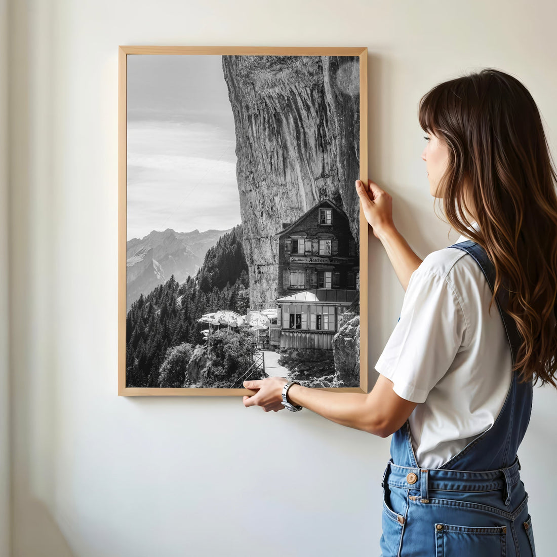 A breathtaking fine art print of Aescher Mountain Lodge nestled against a towering alpine rock face.