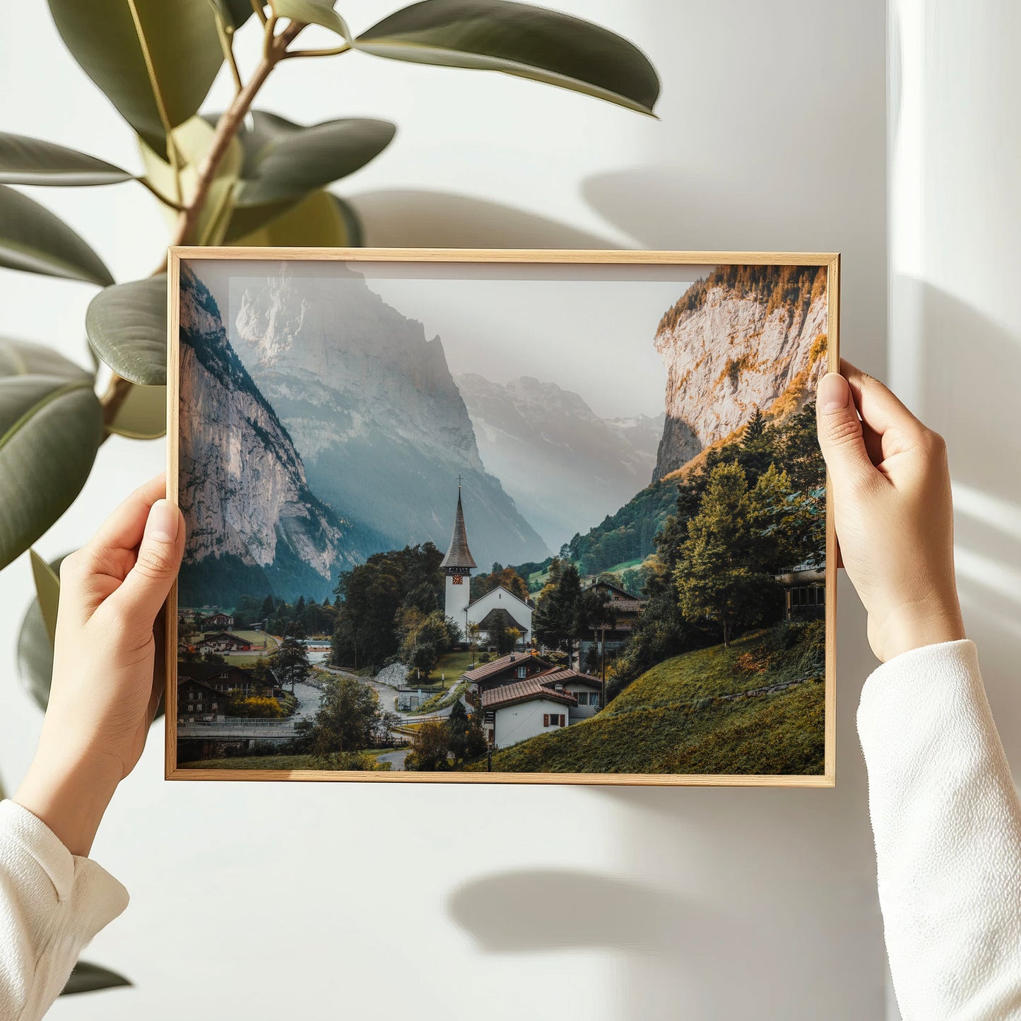 Scenic Swiss Alps wall art featuring the iconic Lauterbrunnen church nestled in a majestic mountain landscape.
