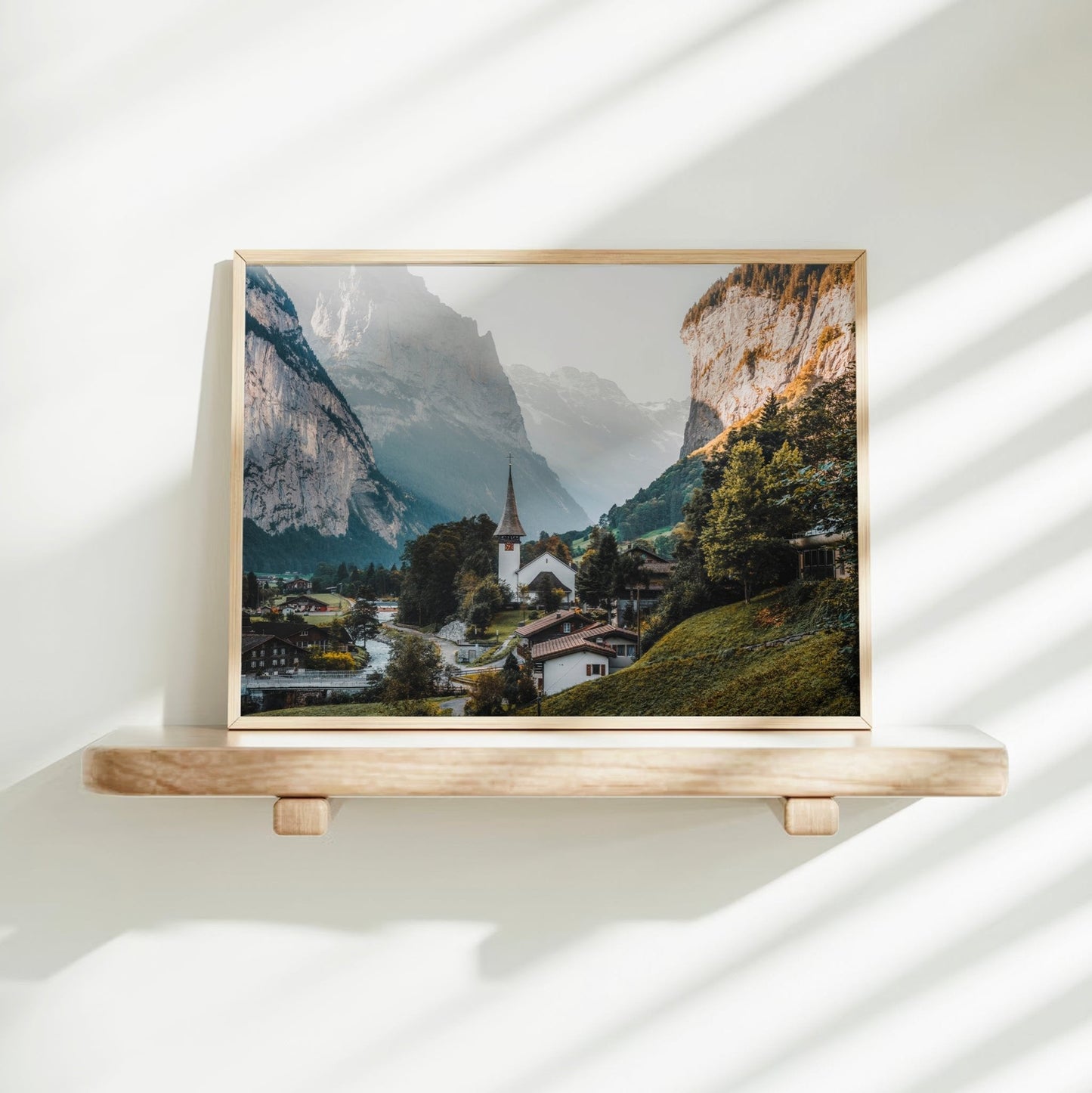 Stunning Switzerland mountain wall decor showcasing Lauterbrunnen’s alpine scenery, quaint homes, and towering peaks.