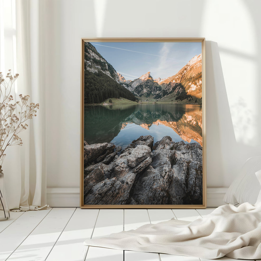 Scenic nature photography print of Seealpsee, Switzerland, featuring rugged rocks and calm waters.