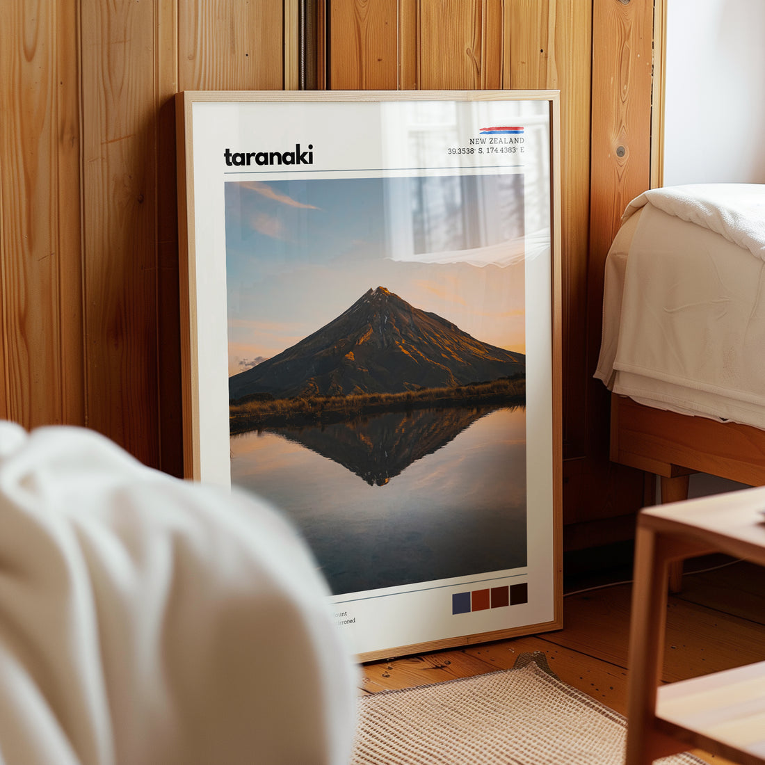 Mount Taranaki wall art print styled in a warm bedroom interior with natural light