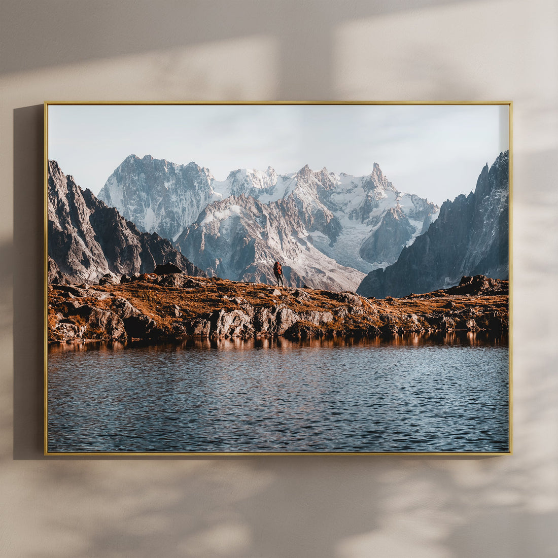 Fine art print of Tour du Mont Blanc with hiker by a lake and snow-covered peaks in the background, Chamonix Alps.