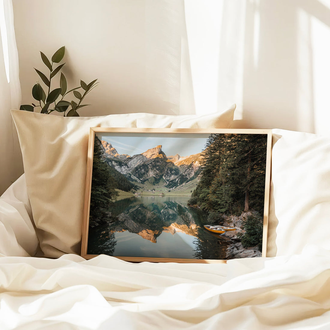 Wall decor print of a calm alpine lake at Seealpsee, with forested shores and epic mountain scenery.