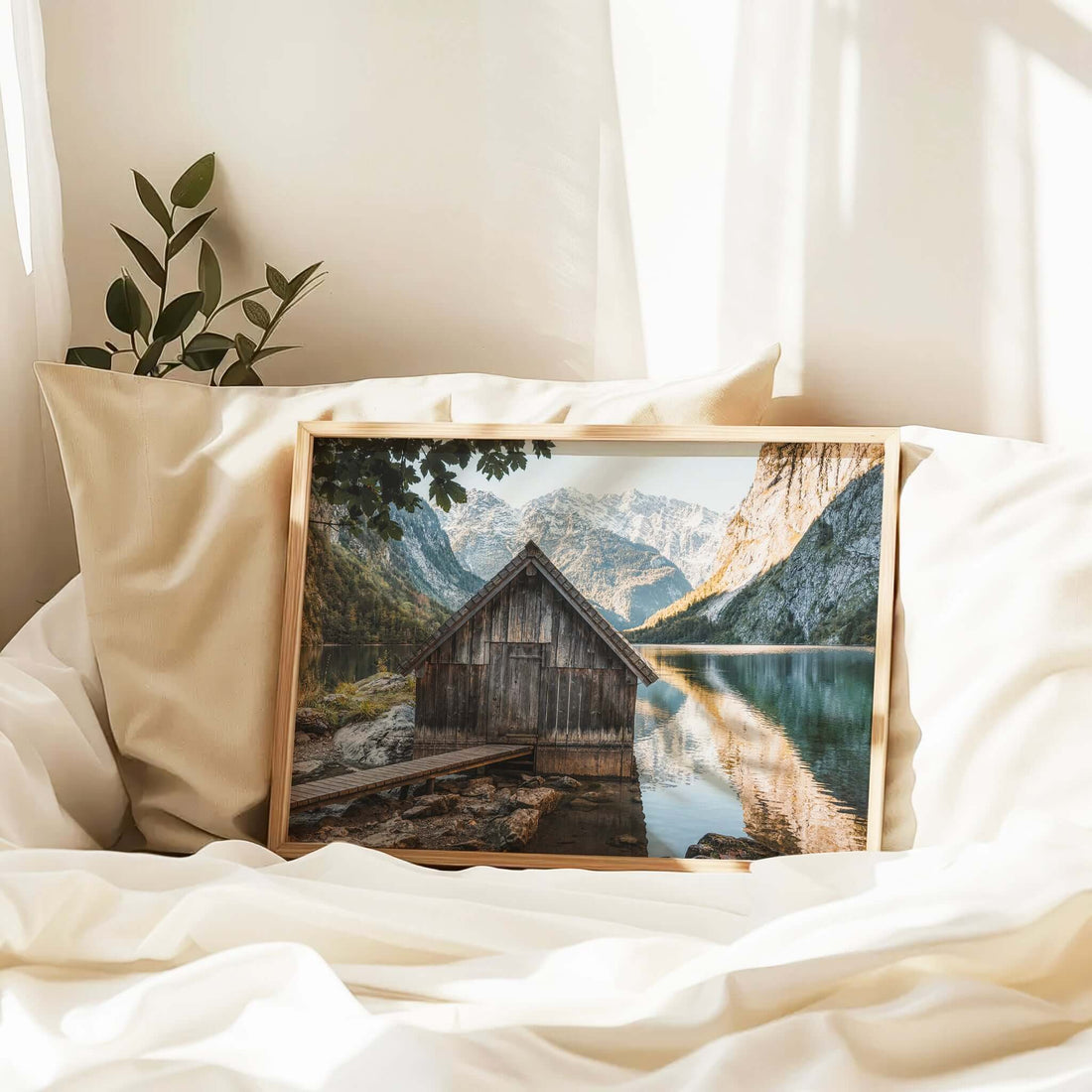 Wooden hut reflecting in still alpine waters at Obersee