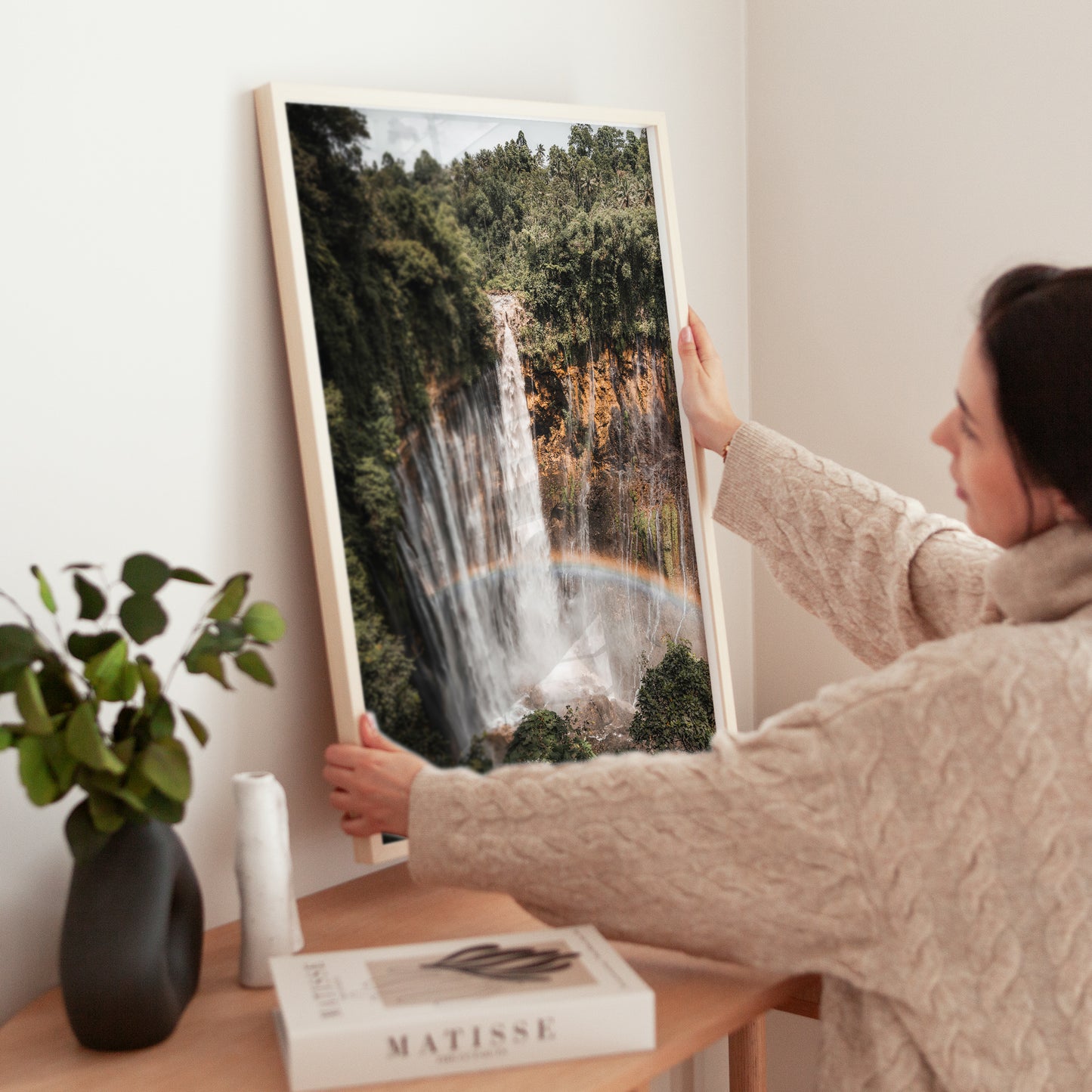 Tumpak Sewu Waterfall wall art print in a styled room with warm tones