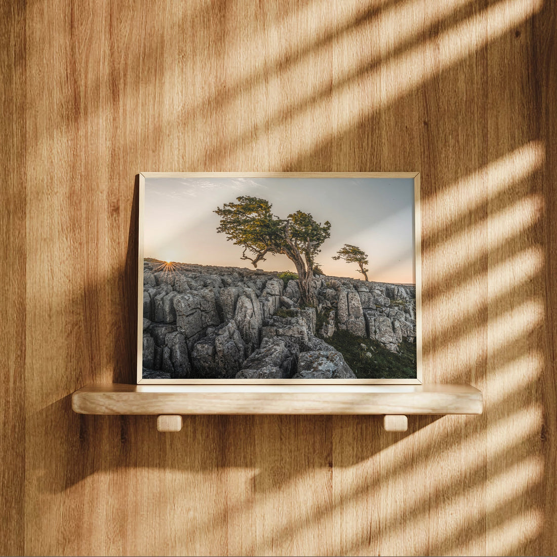 Landscape print of Twisleton Scars displayed on wooden shelf