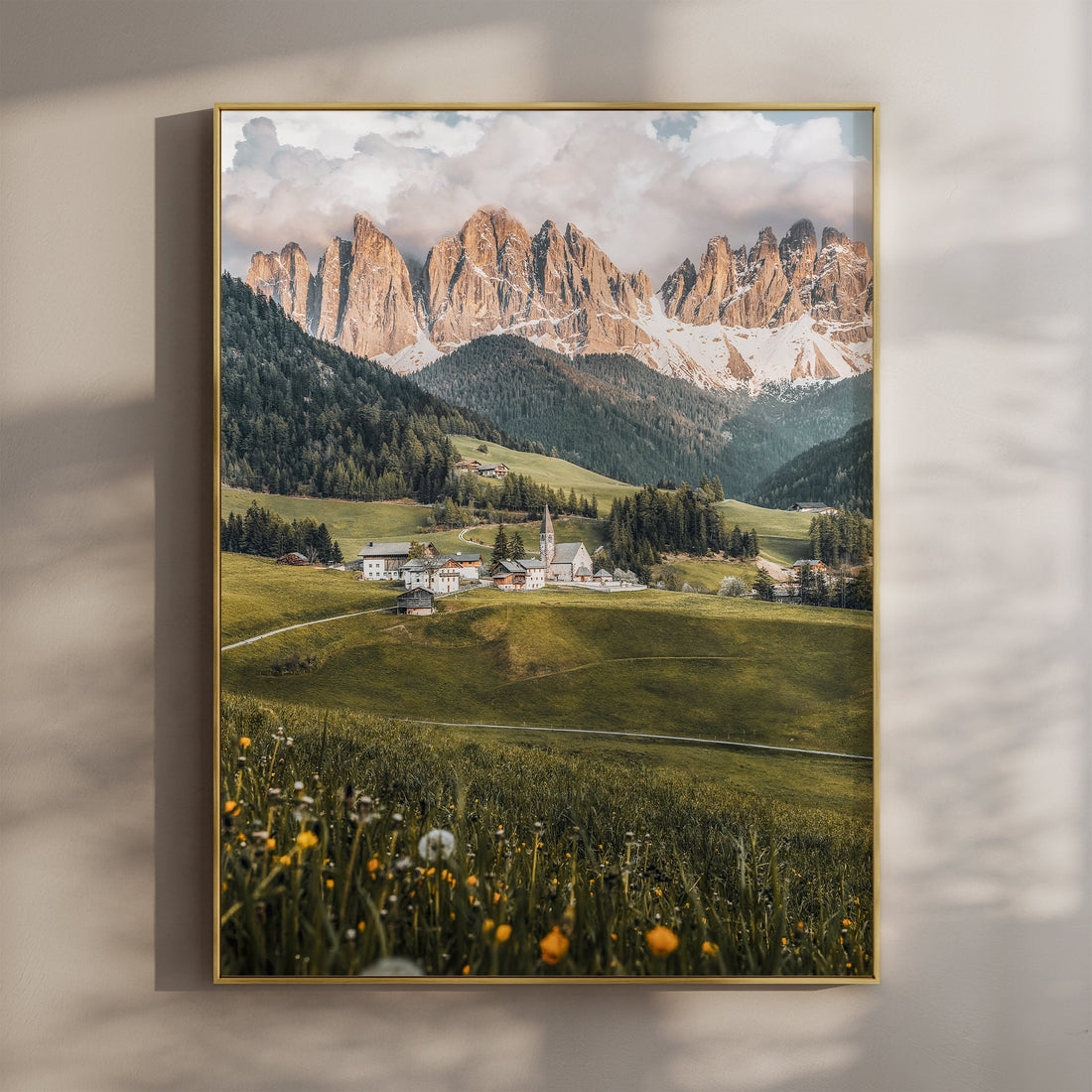 Val di Funes at sunset with golden mountain light above alpine village in South Tyrol