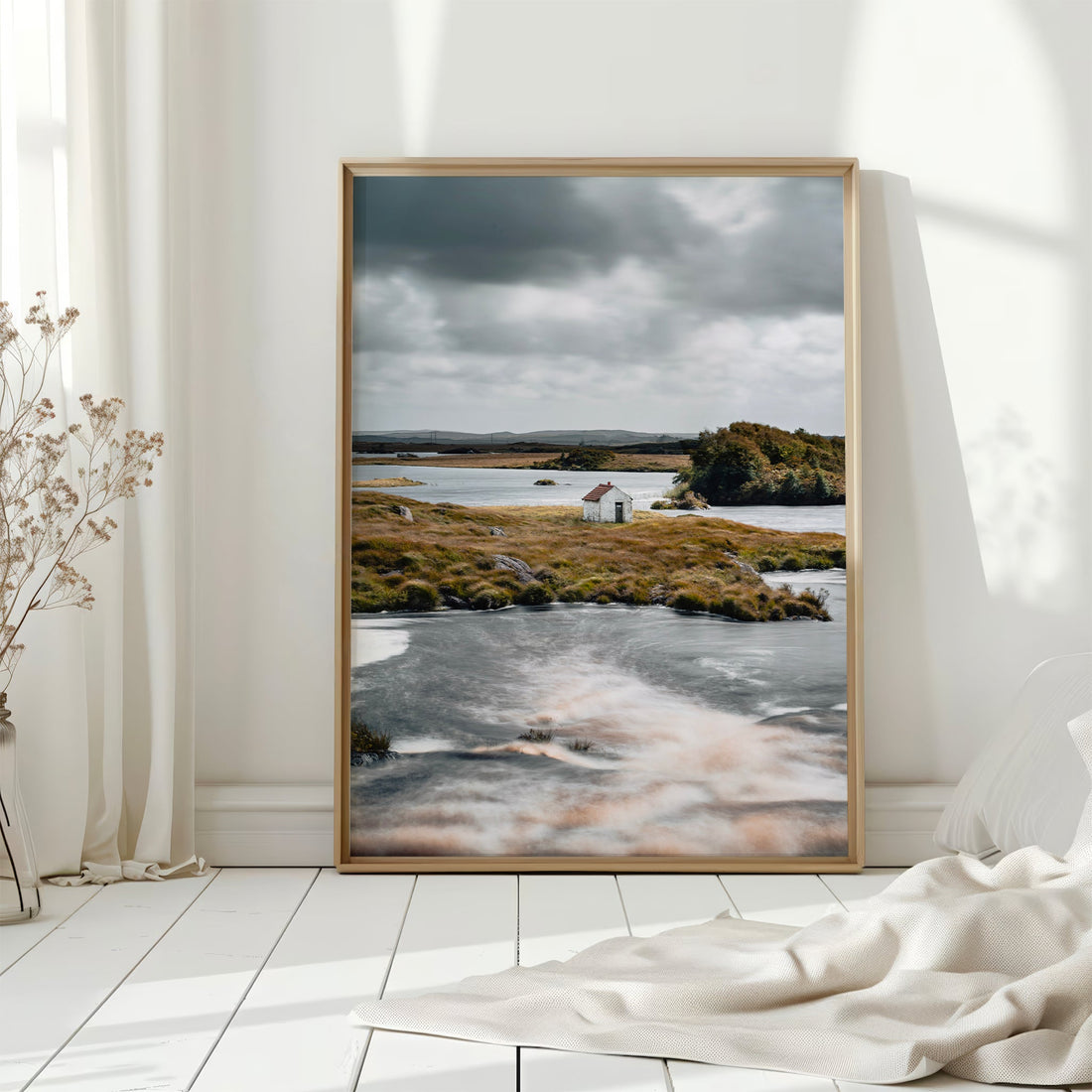 Connemara hut landscape print displayed in a sunlit interior on white wooden flooring