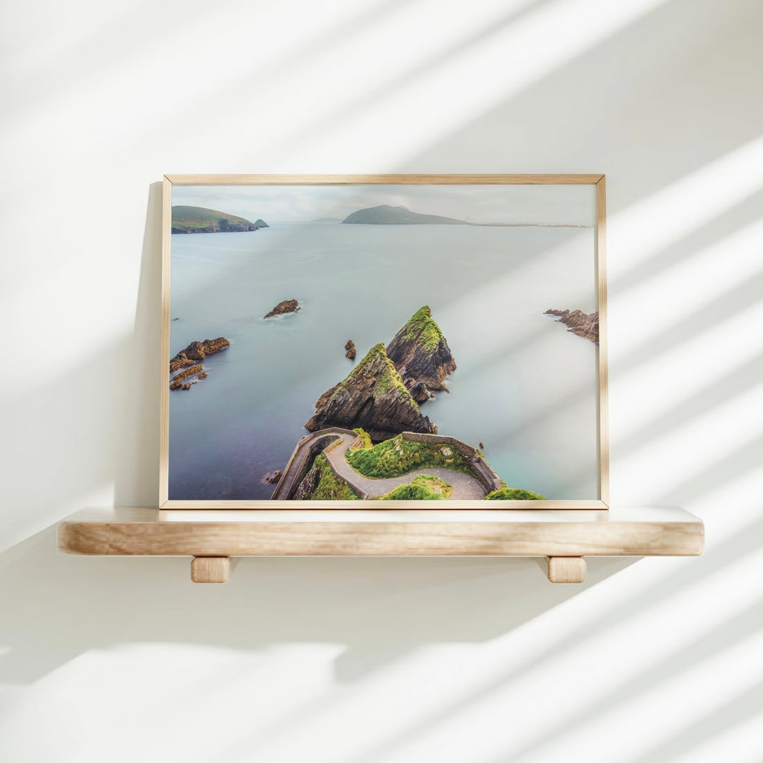 Landscape photography of Dunquin Pier resting on a soft bed in daylight