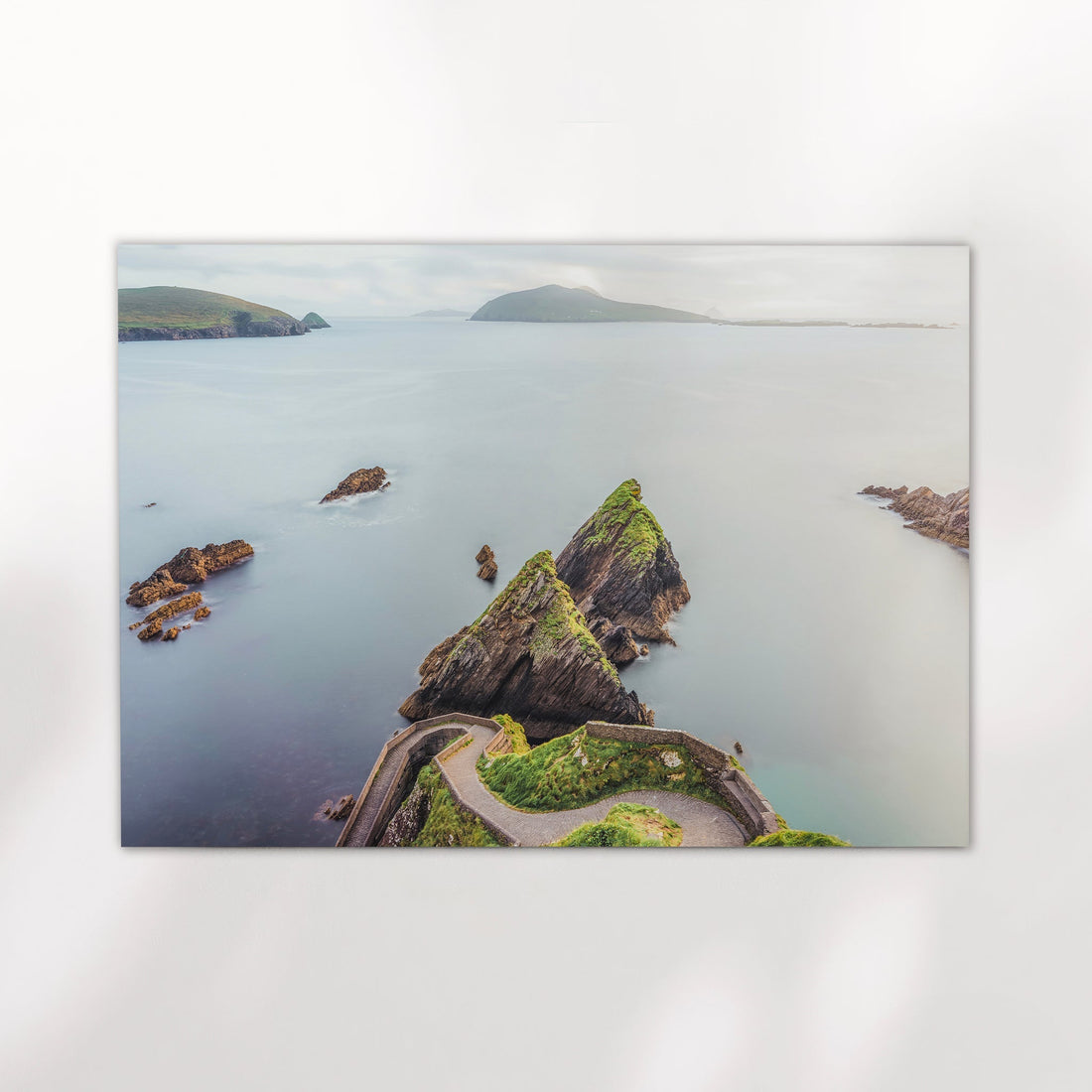 Long exposure photograph of Dunquin Pier and rocky sea stacks on fine art paper