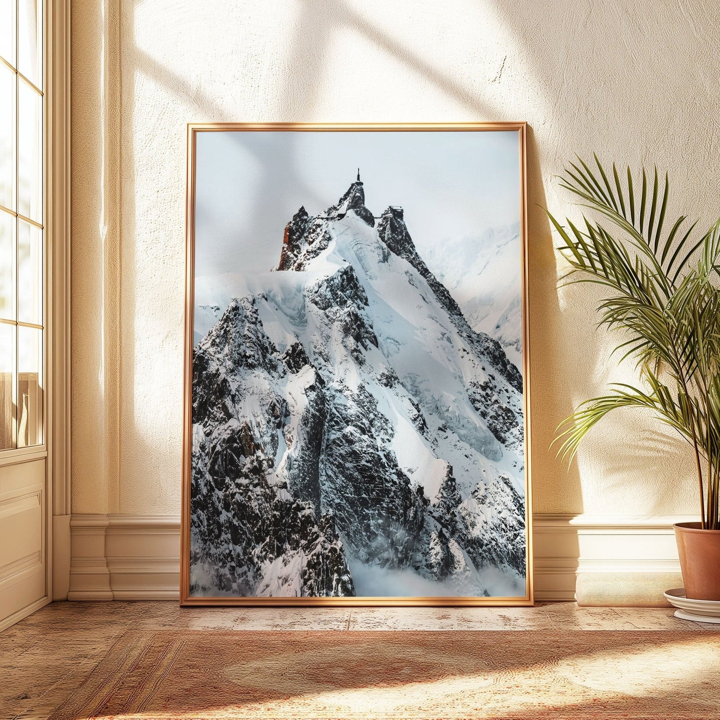 Aiguille du Midi close-up with golden light on snow-covered slopes.