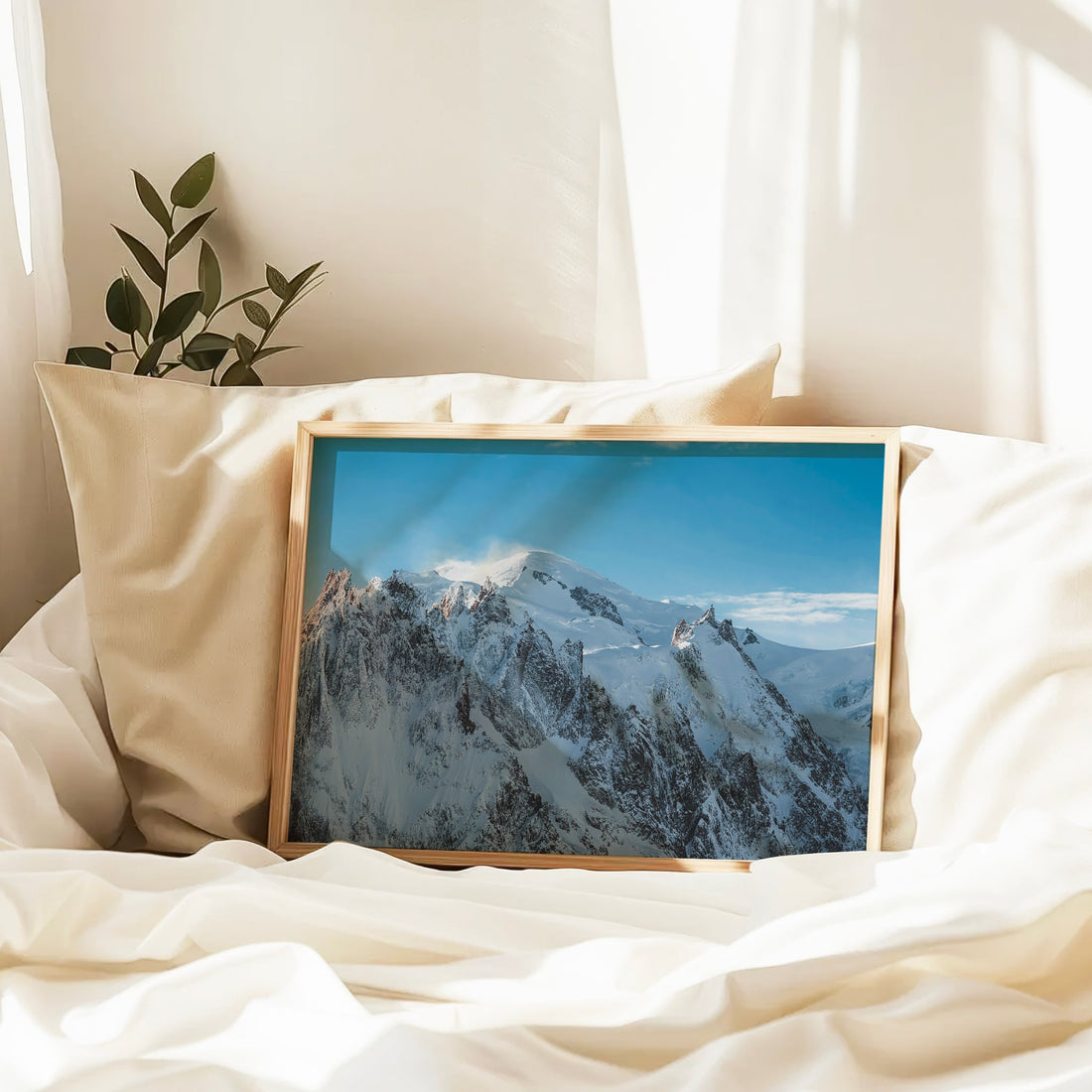 Fine art print of the Mont Blanc massif blanketed in winter snow under a clear sky.