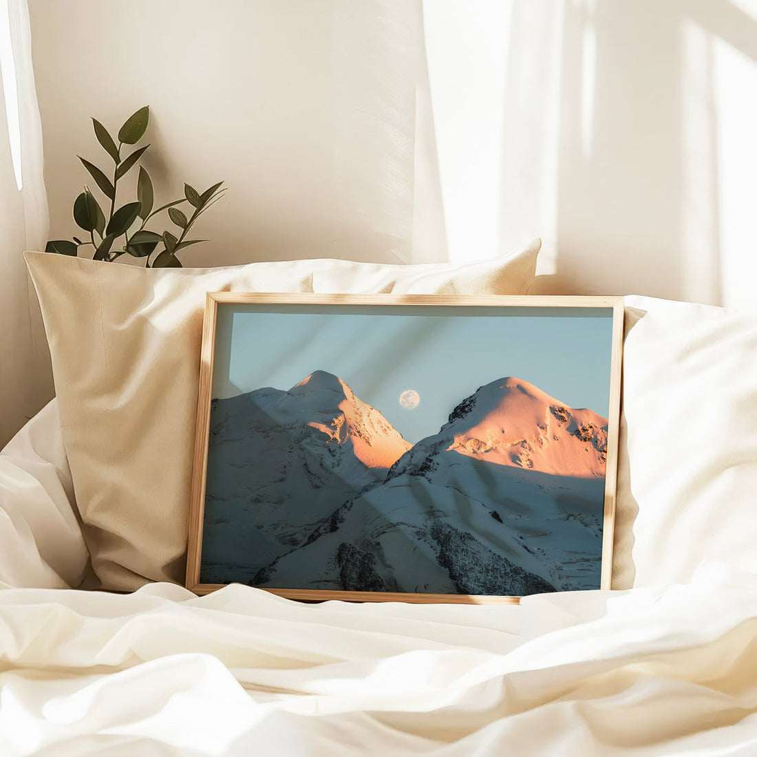 Winter landscape wall art of Castor and Pollux mountains with golden alpenglow and moon over snow ridges.