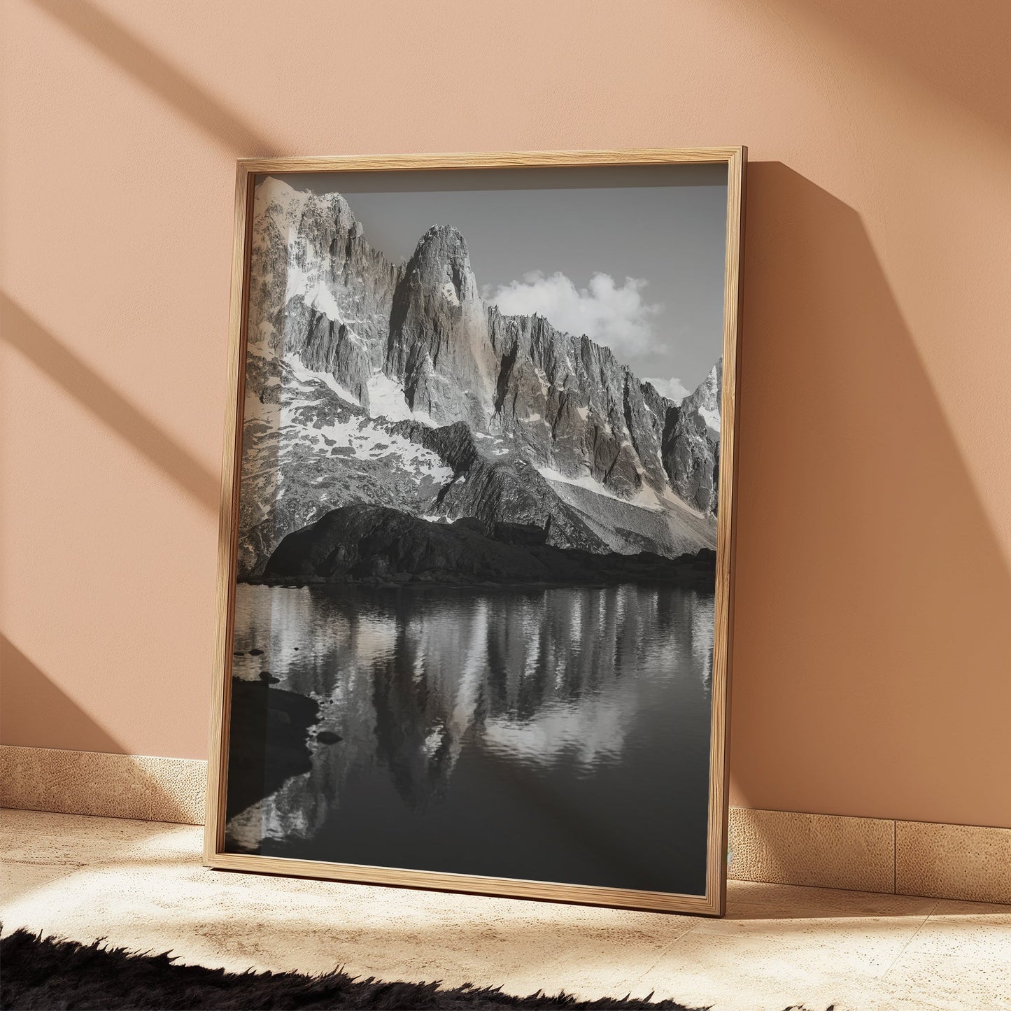 A stunning winter landscape print of Les Drus with snow-covered peaks and dramatic rock formations.