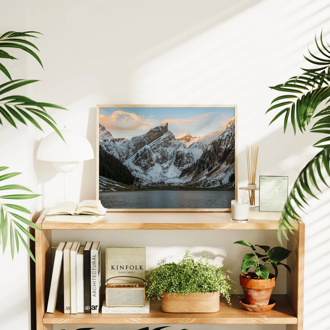 Swiss Alps wall photography print of Seealpsee framed by snow and a glowing mountaintop sky.