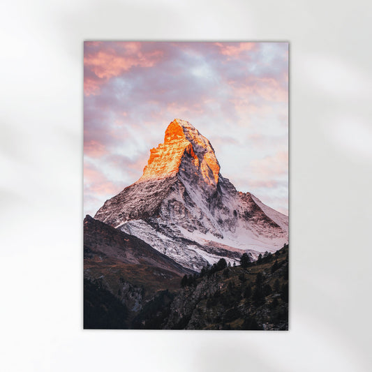 Zermatt Matterhorn photo print showcasing the mountain’s fiery sunrise against a dramatic sky.